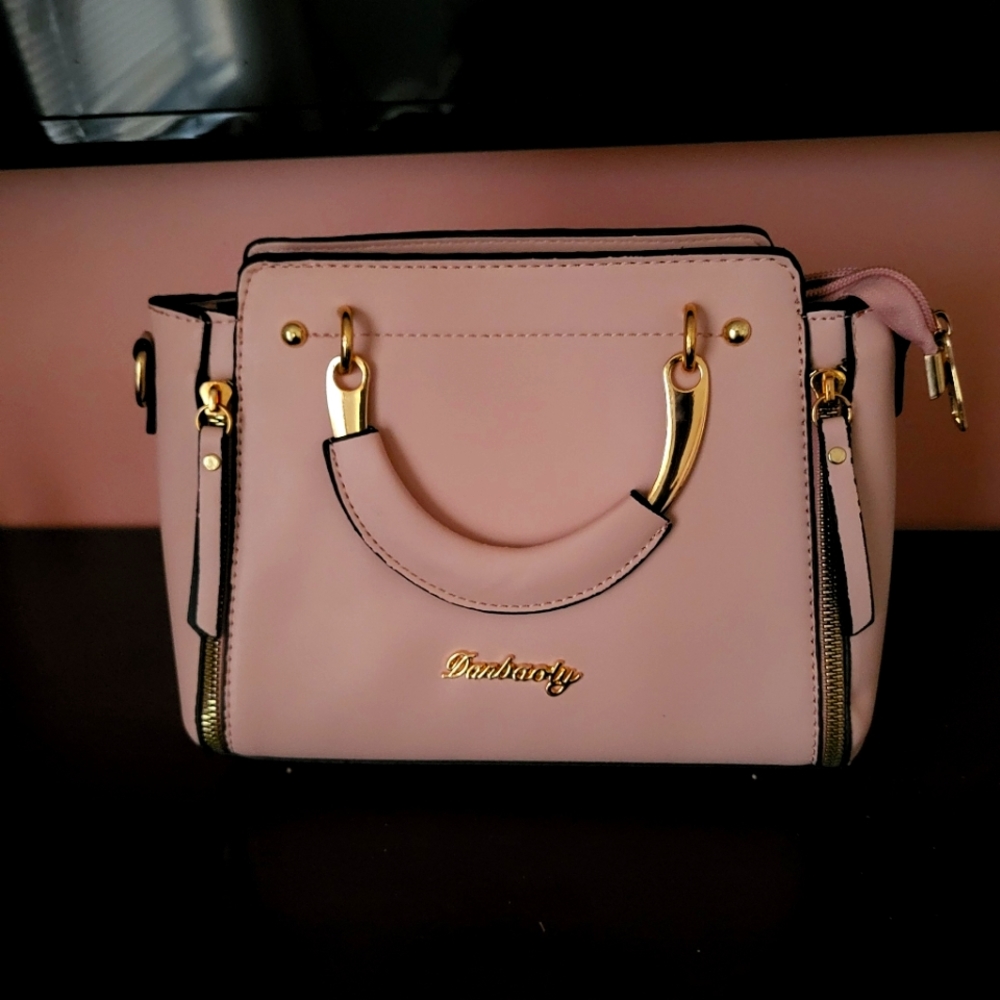 Pink with black stitching and Gold accent purse